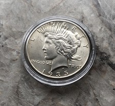 1935 SILVER PEACE DOLLAR IN BU CONDITION.