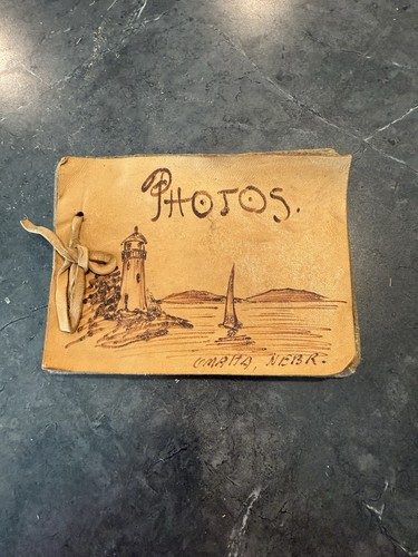 Handmade leather 19th C photo album cover with lighthouse and sailboat drawing.