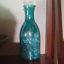 Unmarked Blue Glass Decorative Bottle with Stopper and Blue Glass Pieces Inside