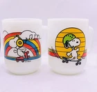 Set Of 2 Anchor Hocking Peanuts Skating Snoopy Milk Glass Vintage Mugs 4”