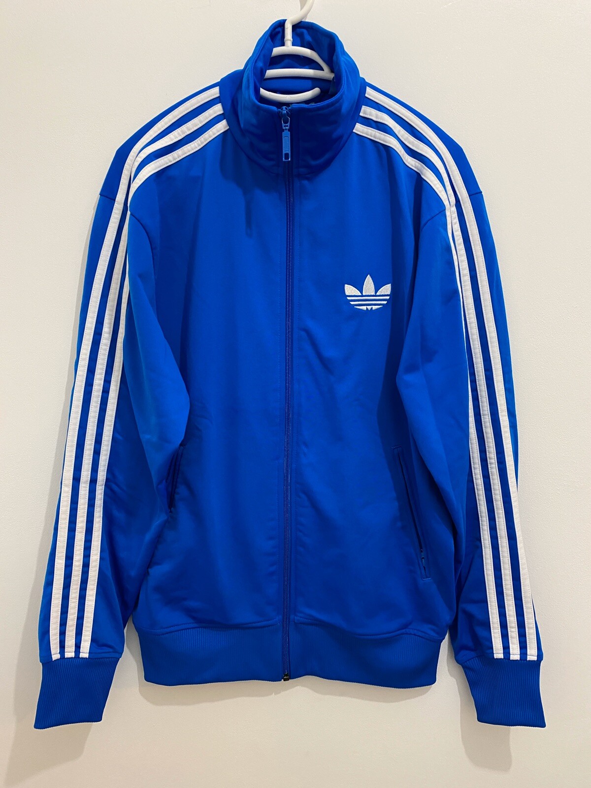 light blue adidas track top