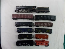 HO Steam Locomotive Pennsylvania 5425 4-6-2 with nine coal cars plus a caboose.