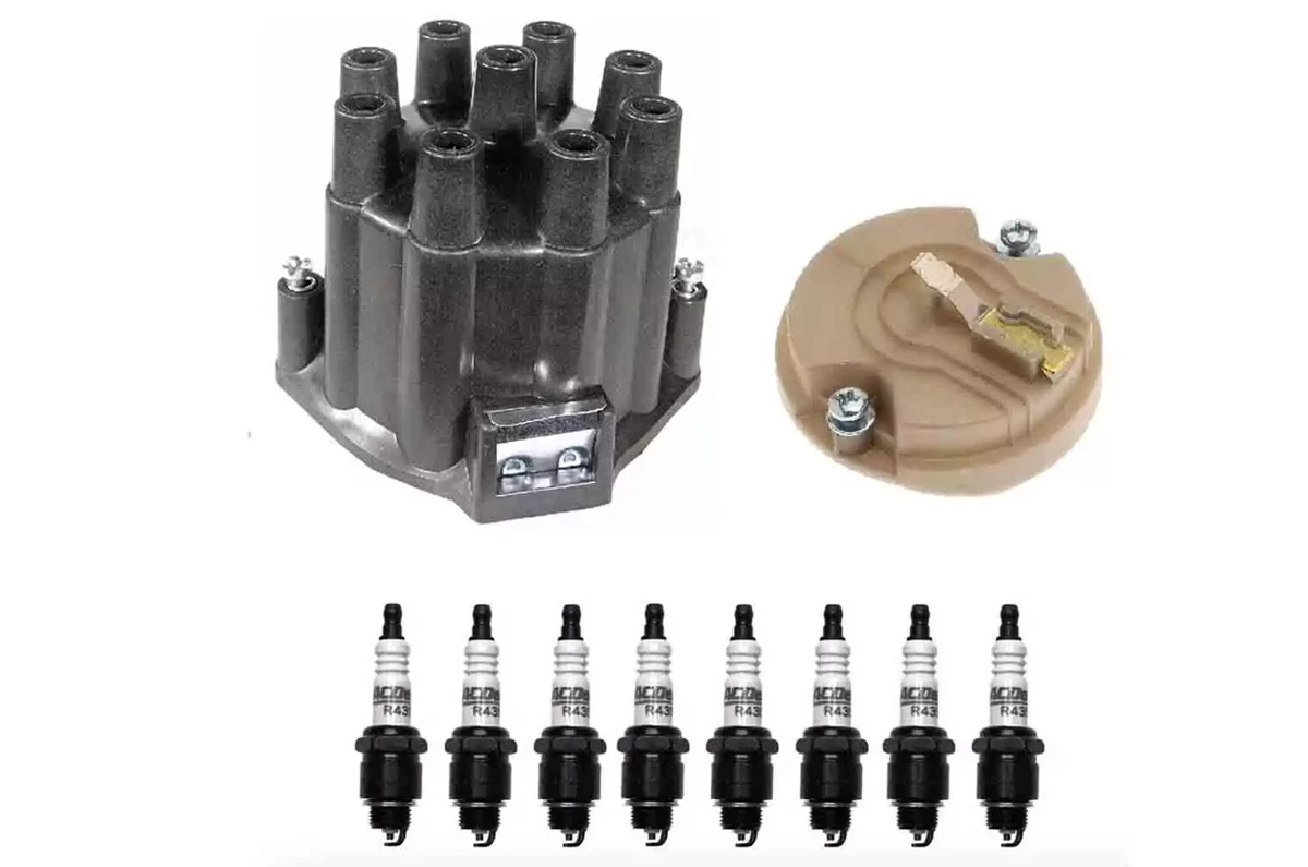 An ACDelco kit with a distributor cap, rotor, and eight spark plugs, displayed on a white background.