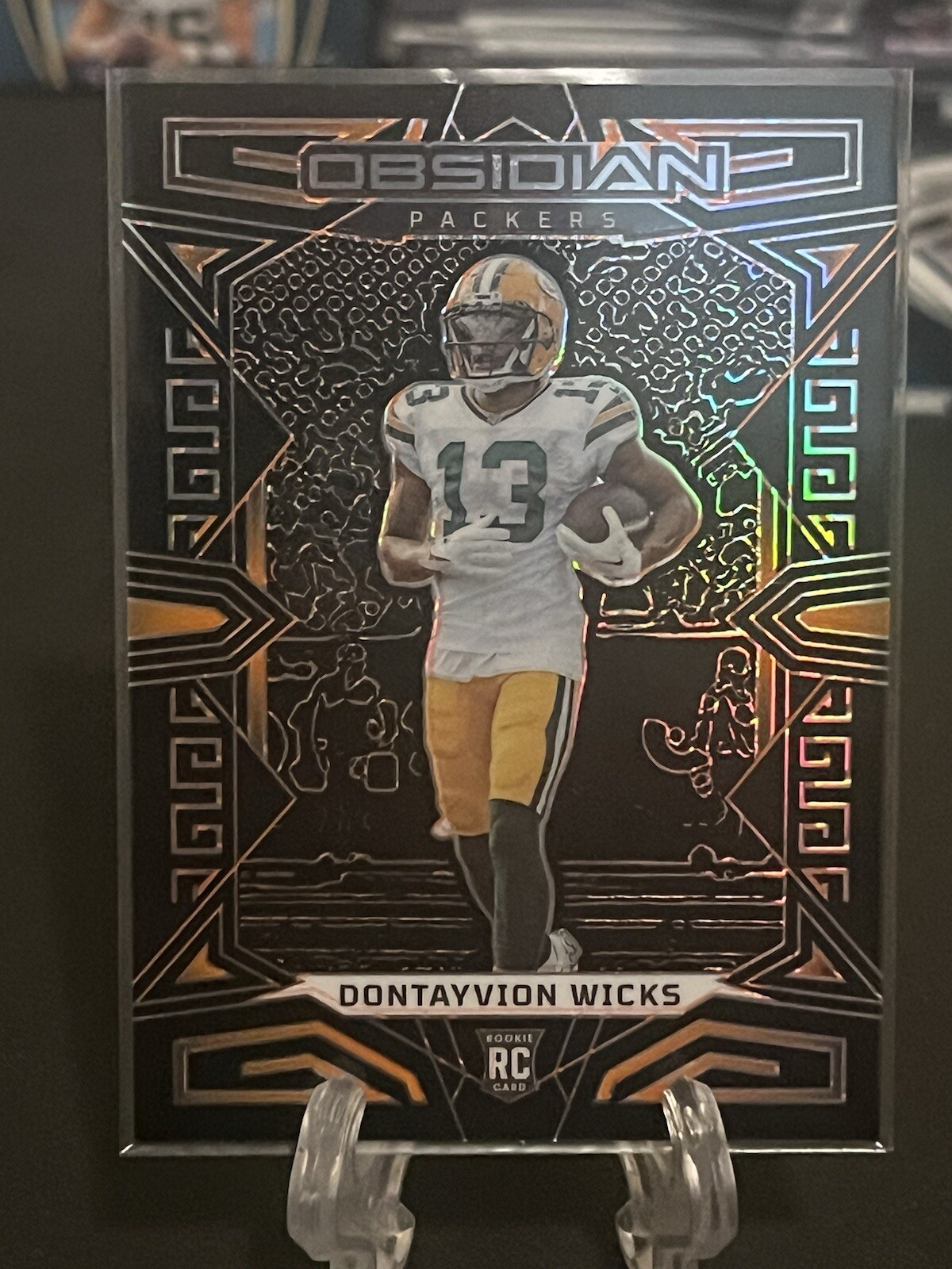 2023 Panini Obsidian #138 DONTAYVION WICKS Orange Rookie /49 Packers RC SP