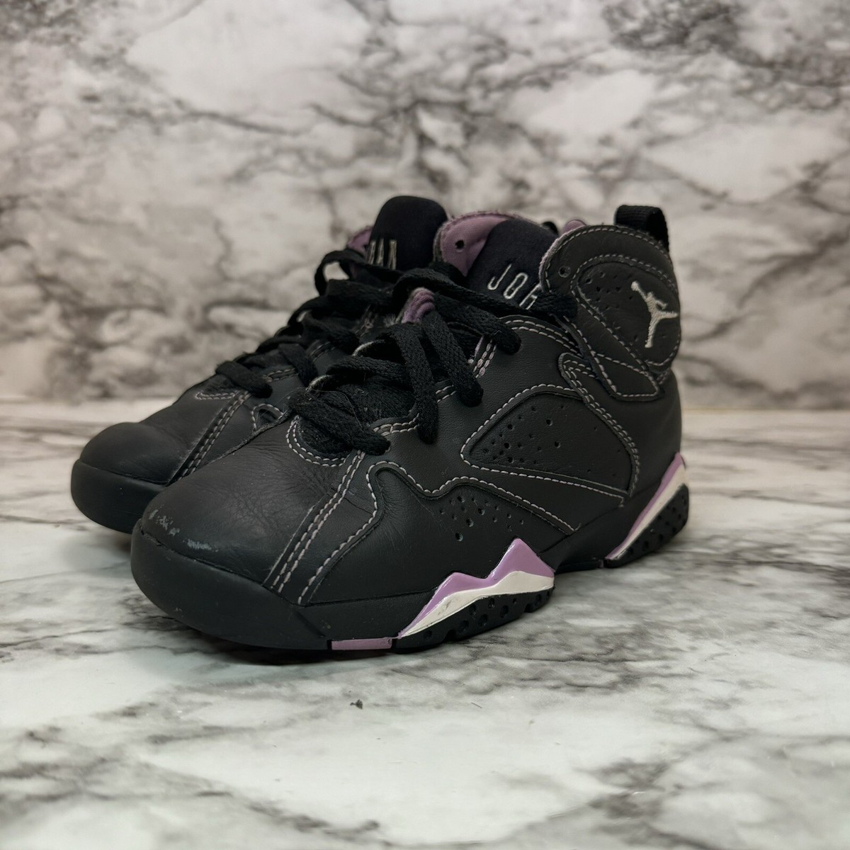 black and pink jordan 11s