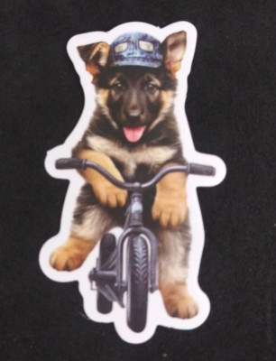 Adorable German Shephard Puppy Riding Bike Sticker 2.75'' x 1.5'' (N)