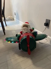 Santa's Best Animated Christmas Santa in plane Read Listing