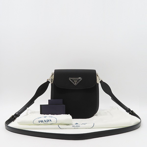 Prada Margit crossbody bag in black Tessuto Vitello with silver triangular logo