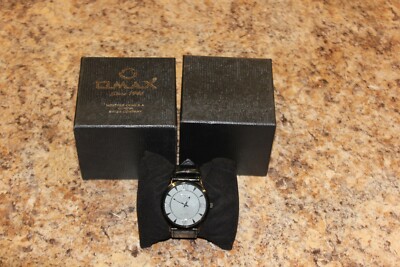 USED BLACK FACE AND BAND OMAX WRIST WATCH 