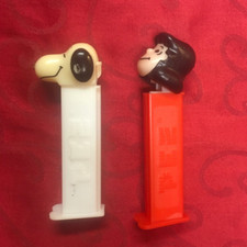 1990  s PEZ Dispenser Peanuts Lucy  Snoopy Lot of 2 Slovenia with Feet Vintage