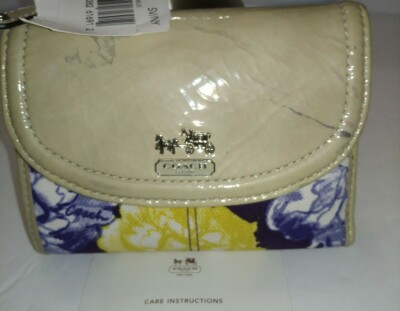 Coach signature floral and color spots on the top of wallet NWT