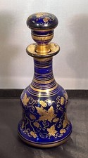 ANTIQUE COBALT BLUE BOHEMIAN GLASS DECANTER WITH GOLD FLORAL OVERLAY AND STOPPER