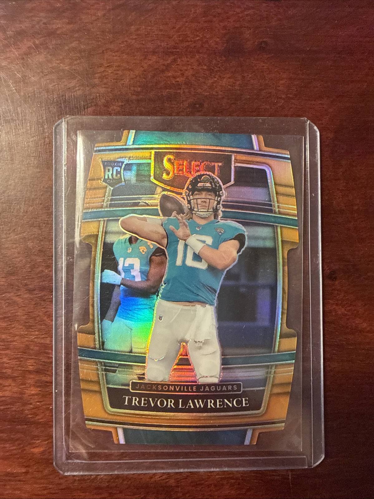 2021 Panini Select Concourse Trevor Lawrence #43 Orange Prizm Die-Cut /249 (RC)