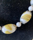 VINTAGE 14 1/2" SMALL WHITE WITH YELLOW SWIRL GLASS BARRELL BEADED NECKLACE — photo 2