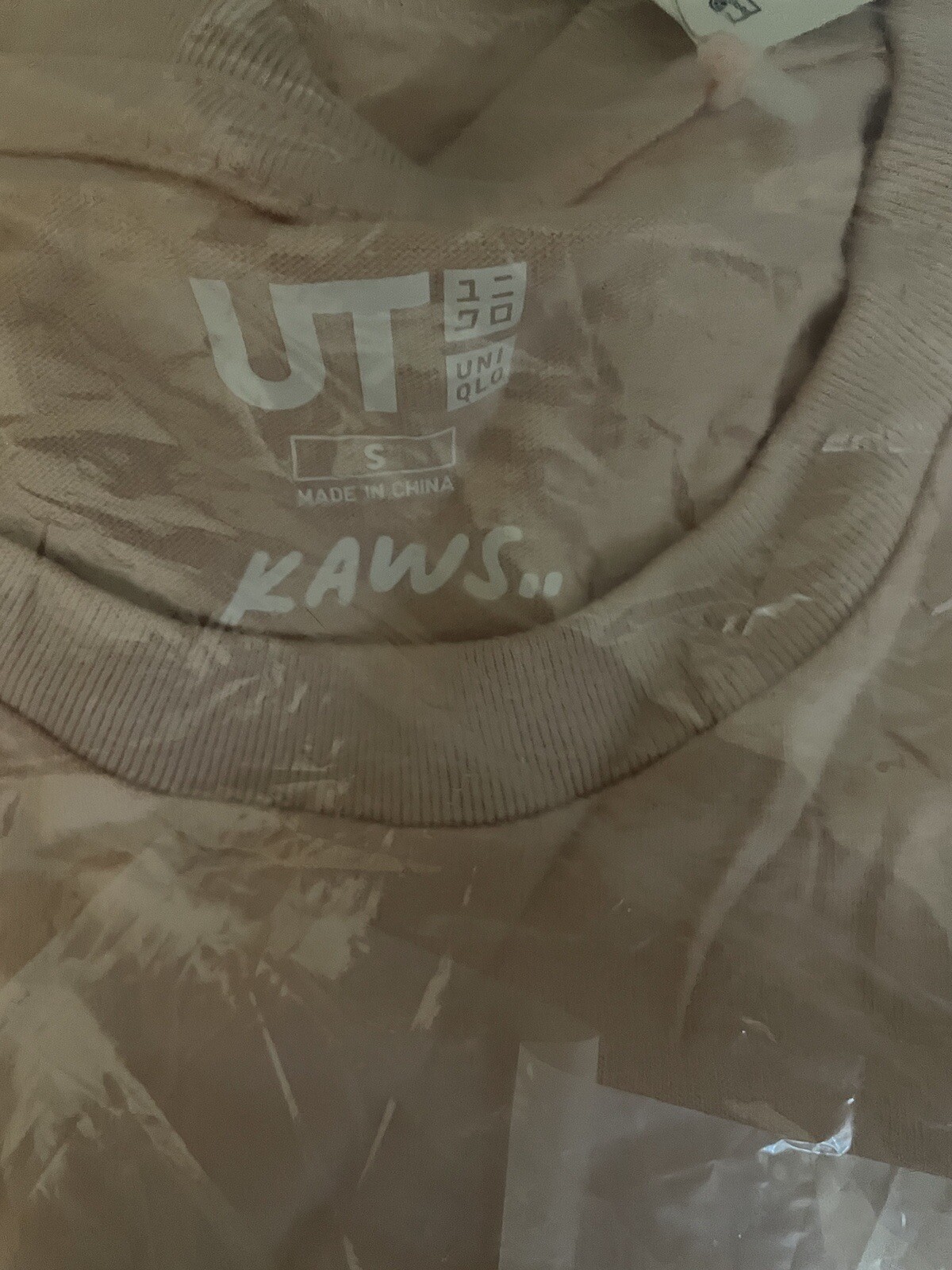 ALTRA Maglietta rosa KAWS x Uniqlo Companion taglia small nuovissima