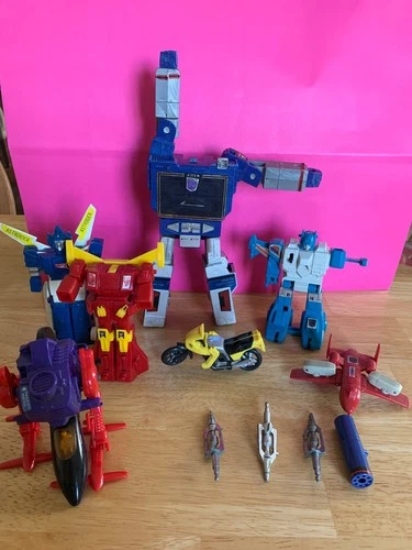 Vintage 1980's Transformer Figures and accessories sold as is.  (Parts)
