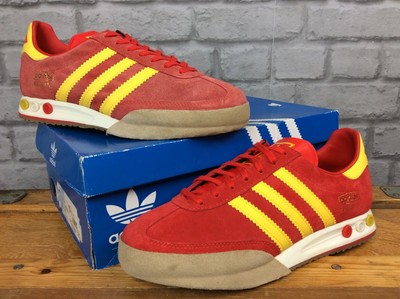 red and yellow adidas trainers