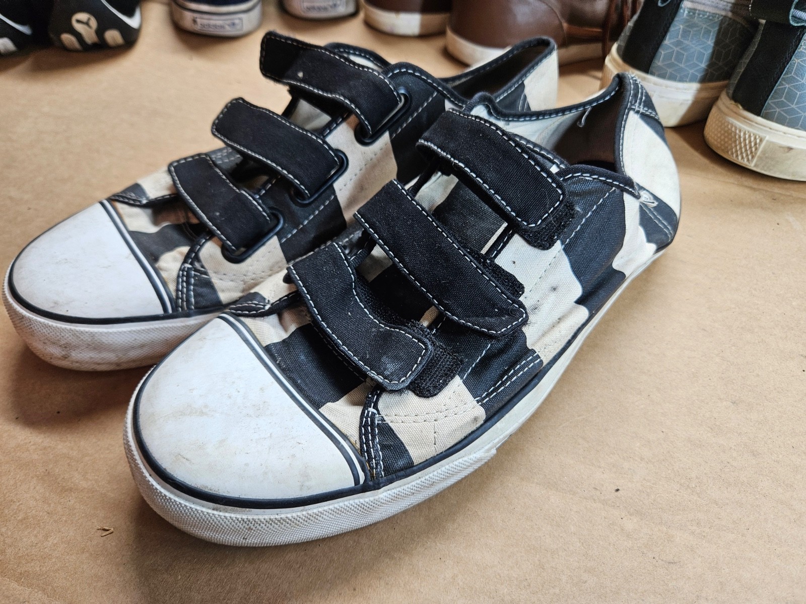 Vans Prison Issue sneakers in a black and white checkerboard or cow print canvas