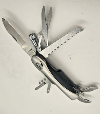 This is a Journey's Edge Trademark 13-Function Pocket Multi-Tool with a built-in