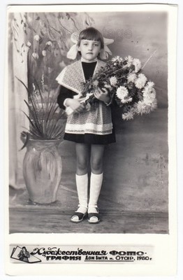Pretty young girl Flowers School uniform dress Lovely face Studio arcade photo