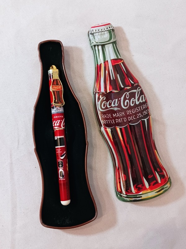 Vintage 1996 Coca Cola Bottle Shaped Tin with History & Writing Pen Inside!