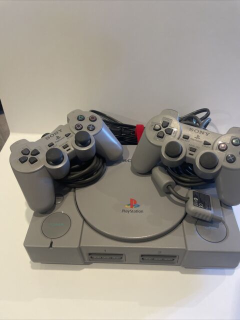 PlayStation 1 console controllers and cords