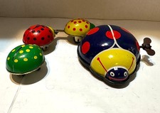 Vintage Tin Wind-up Toy Lady bug Family Parade Works 