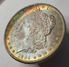 1884 O Morgan BU Silver Dollar Crescent shaped rainbow toning with moon.   #236