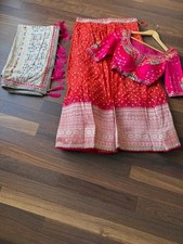 Silk and Georgette Rani Orange Embroidered Badhani lehenga Choli with Dupatta.