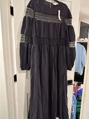 An Asos Beautiful bojo navy maxi dress with cut out work and weave