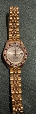 Paolo Gucci quartz wristwatch gold tone diamond markers jeweled bezel date