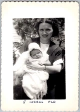 Vintage Snapshot Smiling Woman Holding Baby 1940s
