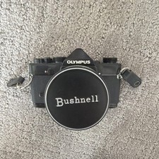 Olympus OM-1 35mm SLR film camera with Bushnell 28mm f/2.8 lens