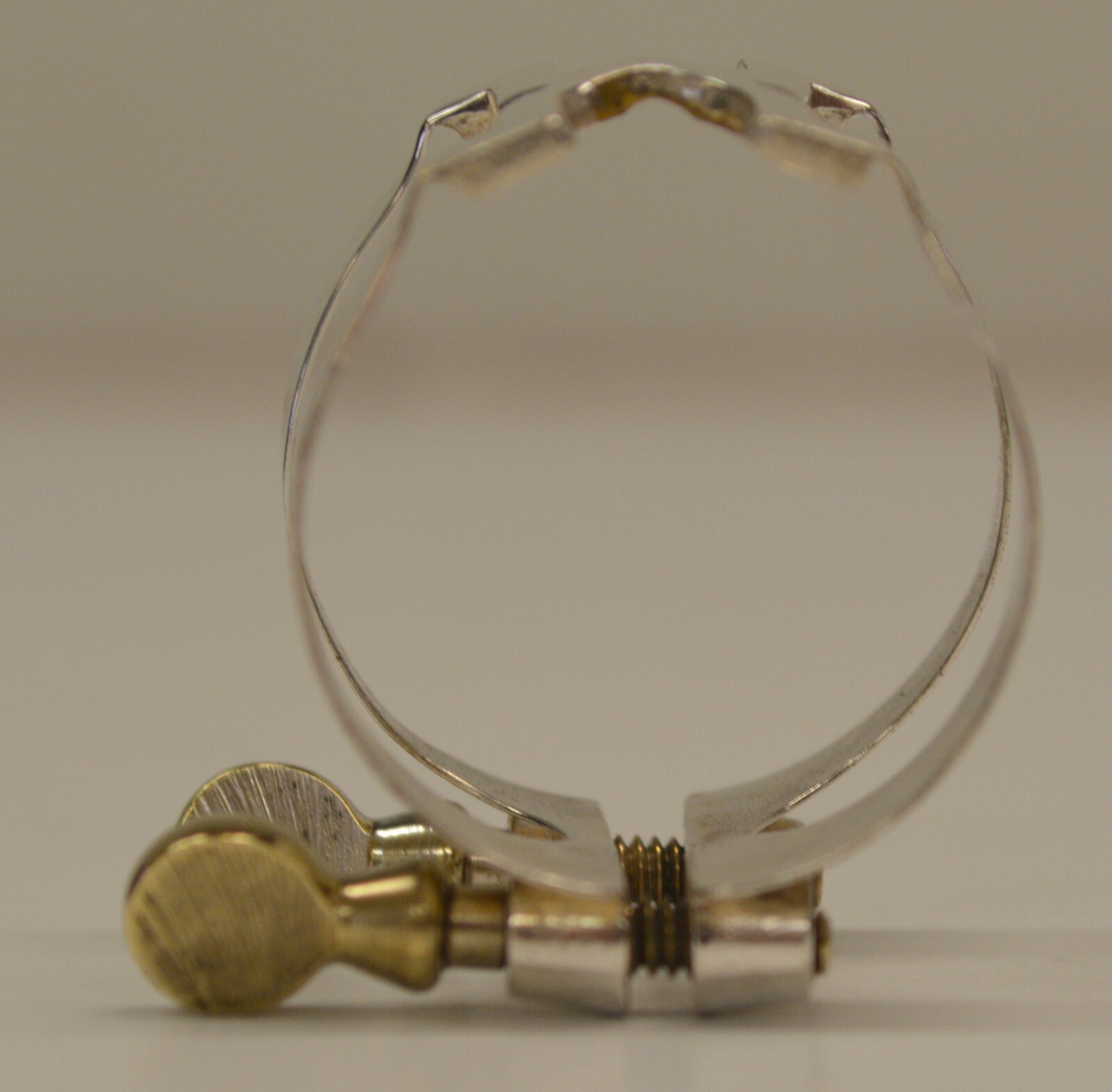 USED VINTAGE HARRISON BARI SAX LIGATURE W/PATENT REFERENCE, MARKED BSL