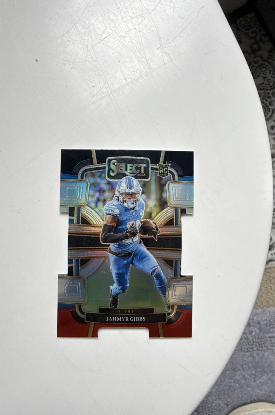 2023 Panini Select - Concourse Jahmyr Gibbs #34 Black & Red Prizm Die-Cut (RC)