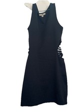 black sleeveless mini dress features distinctive ladder-style side cutouts