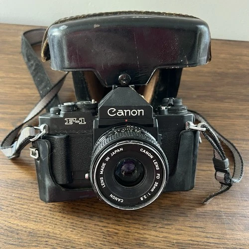 Canon New F-1 Black Film Camera With FD 35mm f/2.8 Lens, Leather Case, And Strap