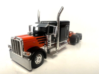 DCP 1/64 SCALE 389 PETERBILT FLAT TOP  ORANGE & BLACK DOUBLE HUMP REAR FENDERS