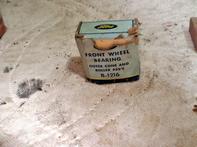 Small white box labeled “Front Wheel Bearing” B-1216 with worn paint and black text reading “Made in U.S.A.”