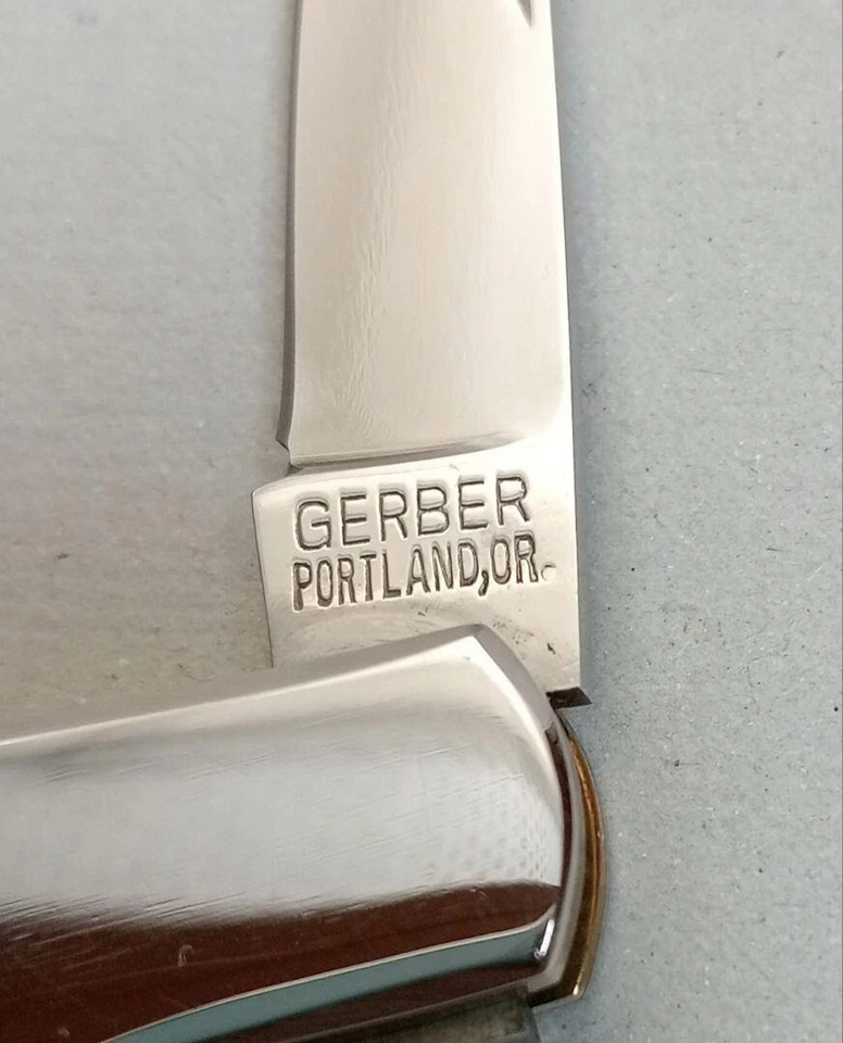 Cuchillo de bolsillo Old Gerber Silver Knight 200A concha de abulón sin usar Foto 3 de 4