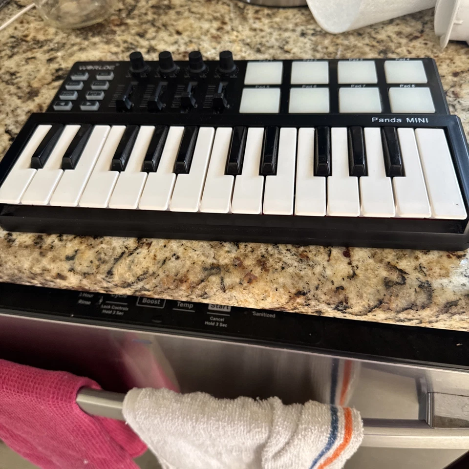 Controlador de teclado Worlde Panda Mini USB MIDI 25 teclas con almohadillas de batería IOB Foto 2 de 2