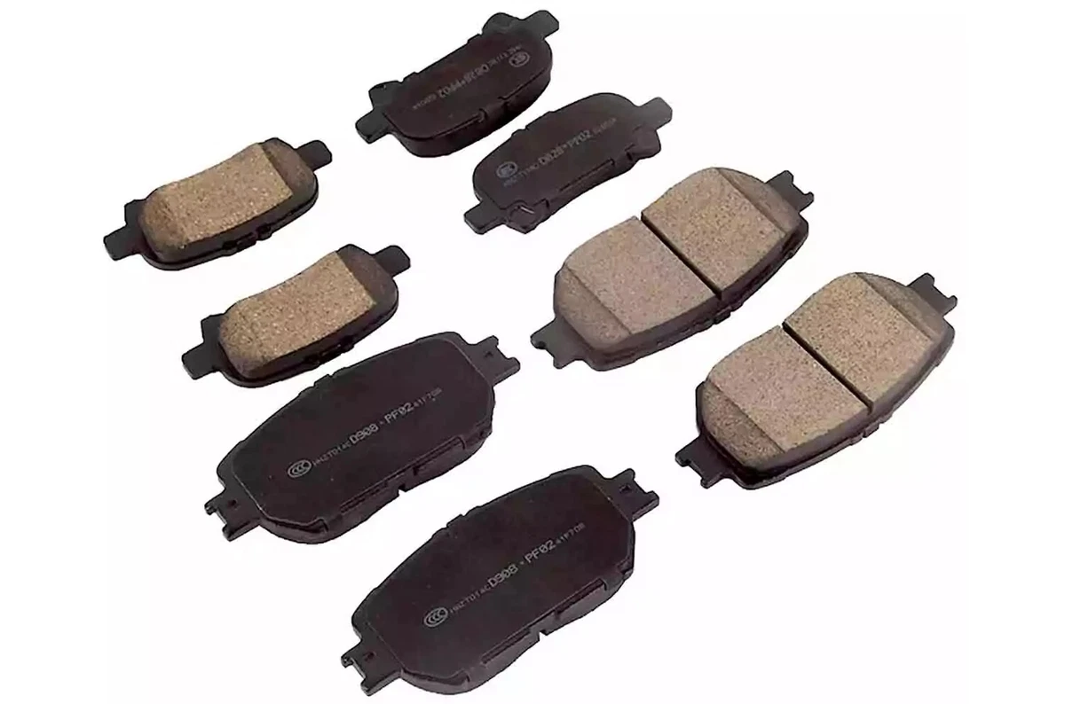 A complete set of front and rear brake pads for the 2002-2006 Toyota Camry, showing the front and back sides, displayed on a white background.