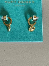 KURT GEIGER LONDON GOLD TONE EVIL EYE HUGGIE HOOP EARRINGS IN MULTI 21MM