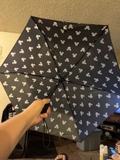 Disney Umbrella With White Mickey Mouse Heads All Over It