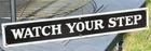 VINTAGE 3" x 21" PORCELAIN WATCH YOUR STEP STORE SIGN BLACK w/ WHITE LETTERS OLD