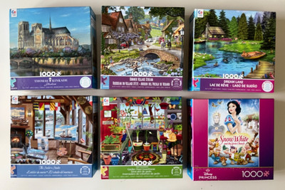 Lot of 6 Ceaco 1000 piece jigsaw puzzles with posters - used once/complete
