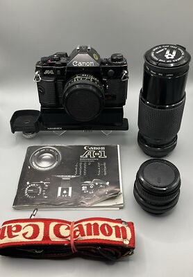 Canon A-1 Kamera mit 3 Objektiven (50mm/f1.8 & 24mm/f2.8 & 80-200/f4.5)