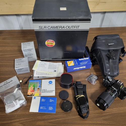 MINOLTA X-7A 35mm SLR Camera with accessories...F3.5 135MM LENS, FLASH, 2X CONV.