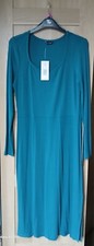 size 12, green bodycon dress, mid length, long sleeves.