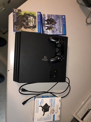 Sony PlayStation 4 Pro 1TB Console - Plus games and striker pack